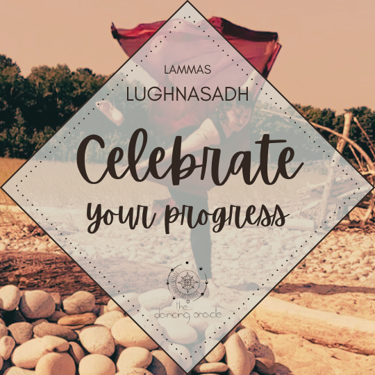 Woman performing an attitude dance move on a beach near a rock fire pit with a large red scarf flowing behind her and text that says Lammas, Lughnasadh, Celebrate your progress