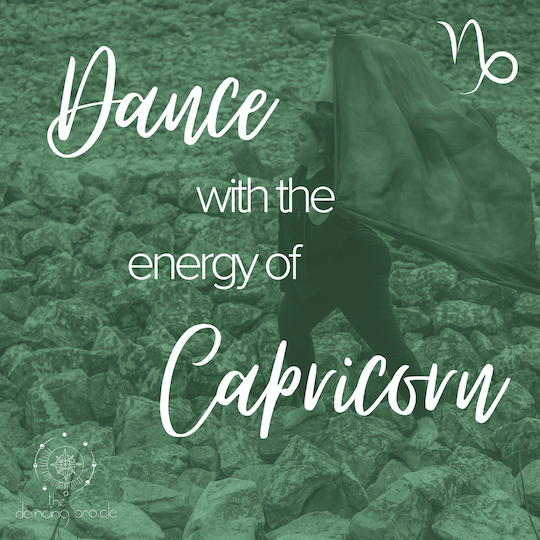 Woman holding a large scarf over her head performing a lunge on rocky terrain and text that says "Dance with the energy of Capricorn"